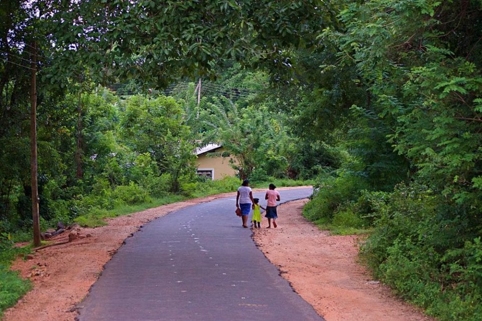 Villagers walking down the road in Sri Lanka