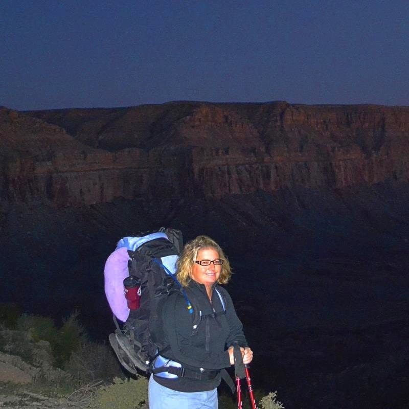 Jenn getting reading to hike to Havasu Falls with a full pack at dawn