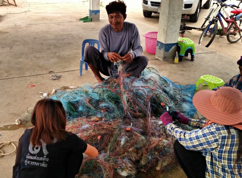 Cleaning the nets at the fishing dock