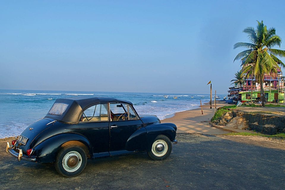 A interesting classic car on the beach at Hikkaduwa Sri Lanka.