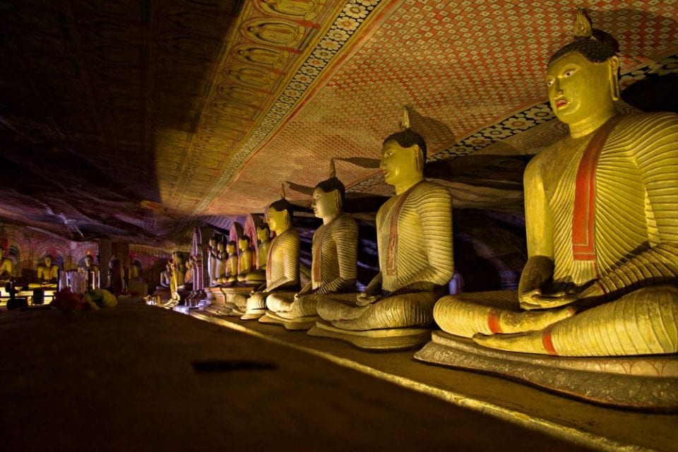 A line of Buddhas inside of the Dambulla Cave Temples