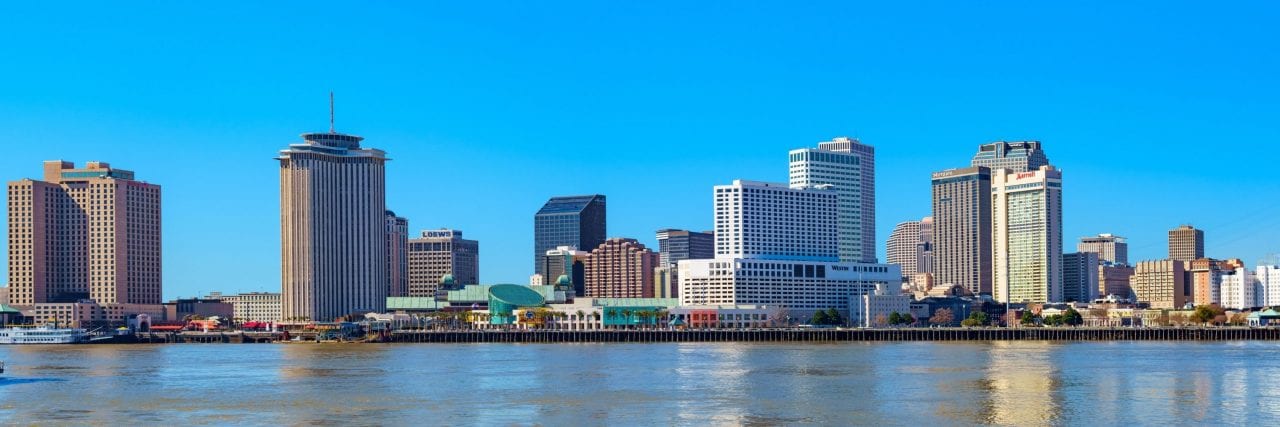 New Orleans Skyline via Canva from the Mississippi River Trail