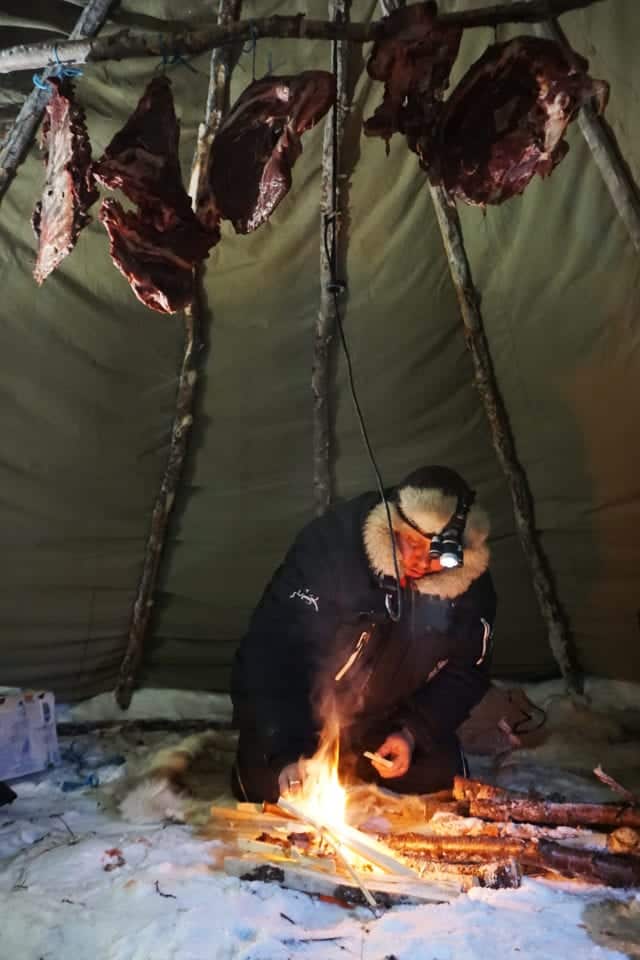 Sami man smoking meat via Kelley Louise: Impact Travel Alliance (link in photo)