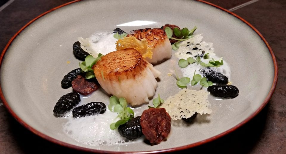 Seared Scallops with squid ink gnocchi. Locally sourced from Chez Muffy