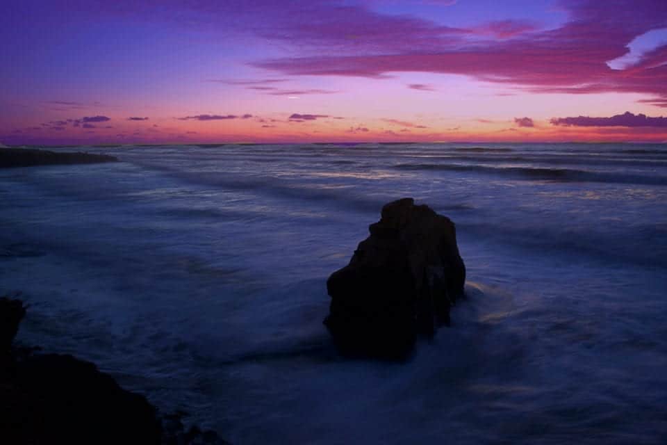 the 30 second exposure turned the rough seas into cotton candy and captured all the purple rays