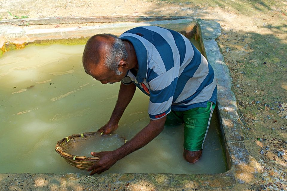 Washing Moonstone at the mine near Hikkaduwa Sri Lanka