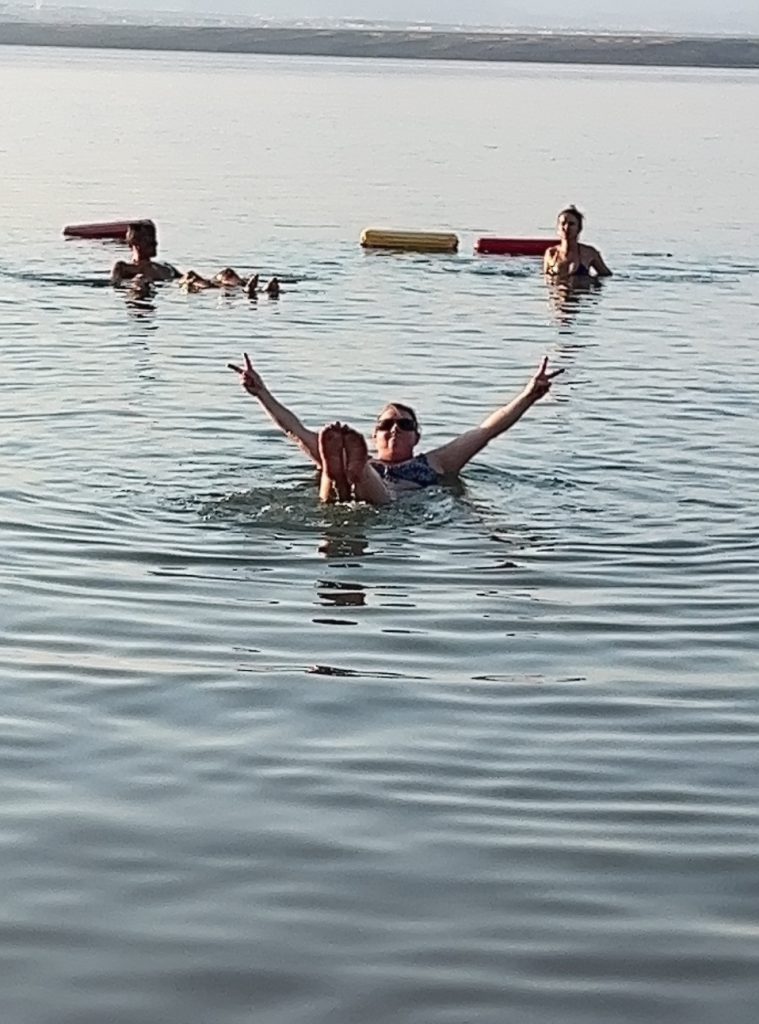 Jenn floating in the Dead Sea, photo by Sharon Kurtz