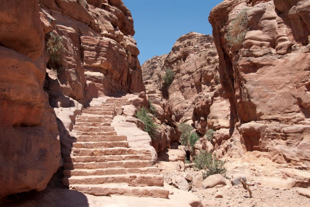 Petra stairs to the Treasury via Canva, 2000 year old stairs are one of the major hazards of Petra