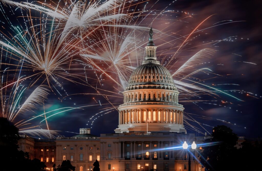 July 4th Independence day show cheerful fireworks display on the U.S. Capitol Building in Washington DC USA