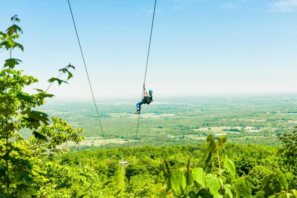 Young woman zip-lining 