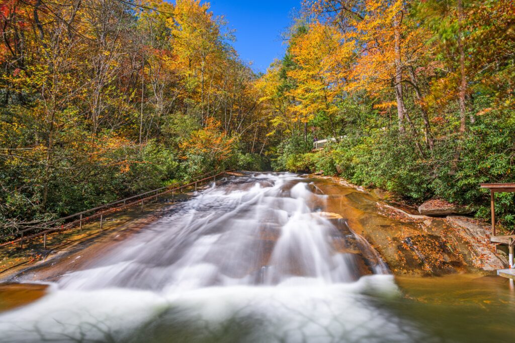 Sliding Rock Falls on Looking Glass Creek in the Pisgah National Forest, North Carolina, USA in the fall season.