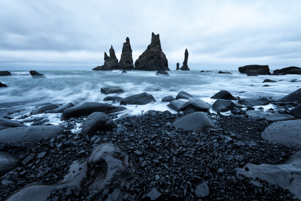 Reynisdrangar seastacks near Reynisfjara beach by the coastal village Vik, Iceland