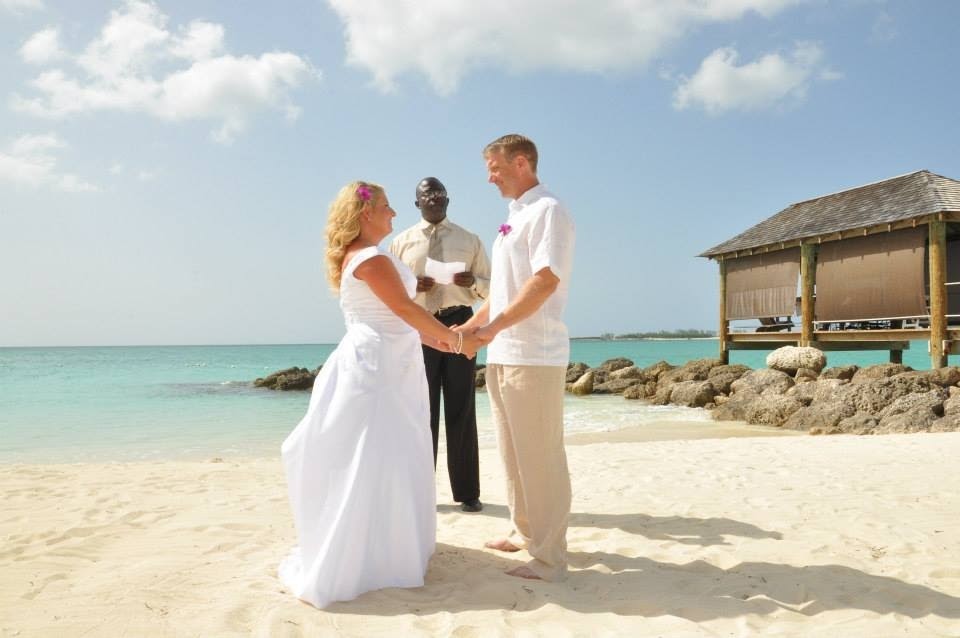 Ed and Jenn saying vows Wedding Sandals Royal Bahamian 2013