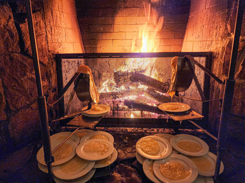 Cheese melting by fire at Fireside Dining at Empire Canyon Lodge, Deer Valley Utah