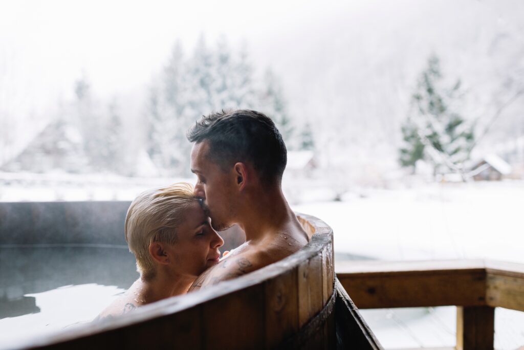 Young couple in hot spring. Couple relaxing in spa resort.