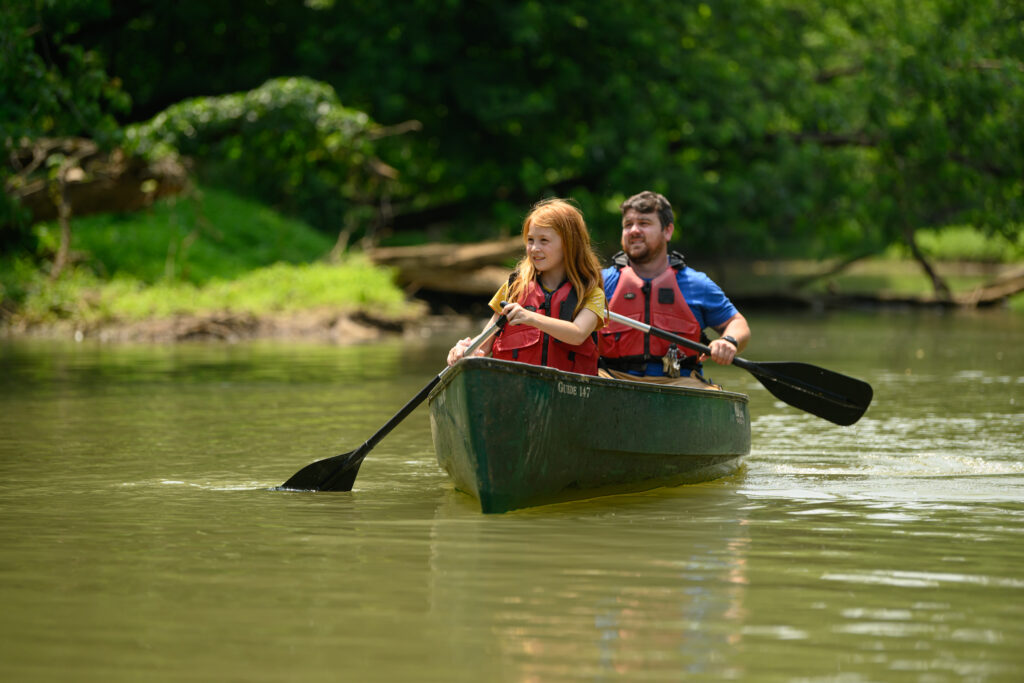 Man and girl kayaking